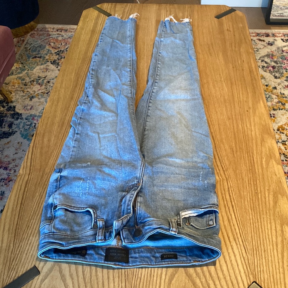 Light blue ripped jeans
